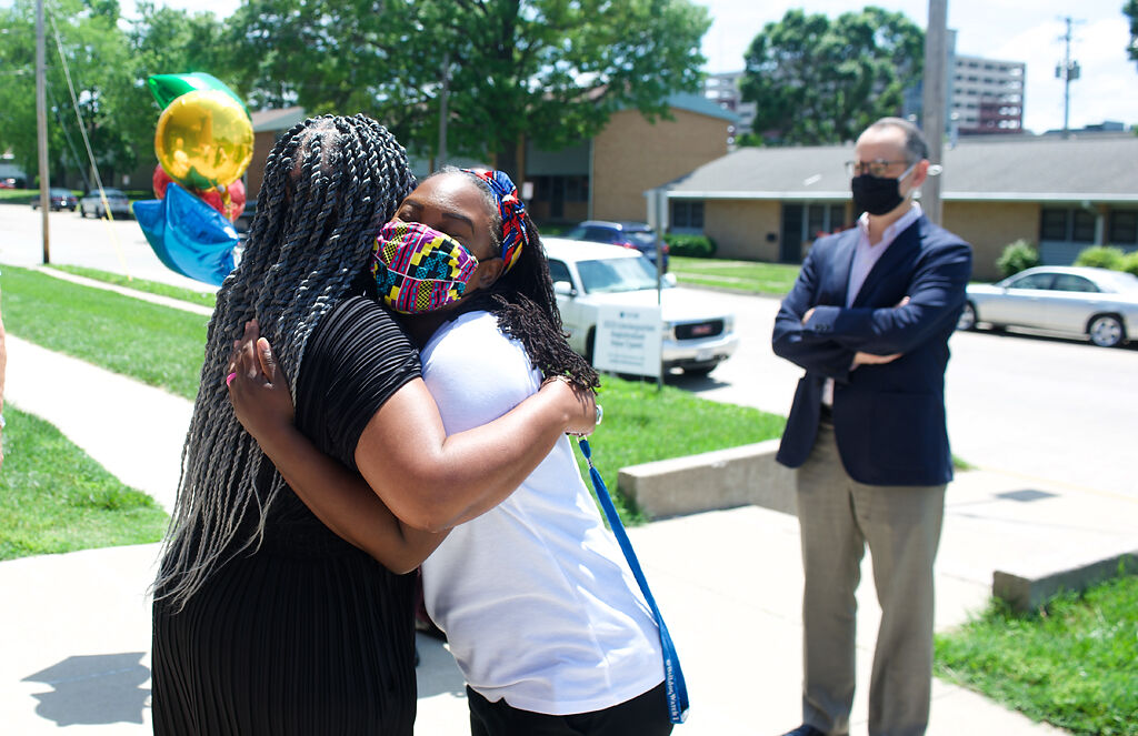 Brittany Fatoma hugs Eryca Neville